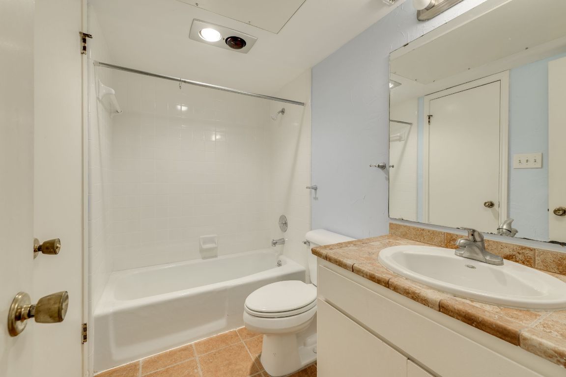 9226 Jollyville Road, Unit 132 Austin, TX 78759 - Photo 20 of 25 Bathroom with vanity, shower / tub combination, and light tile patterned flooring