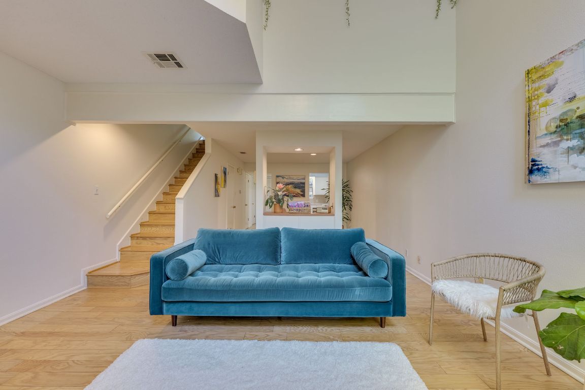9226 Jollyville Road, Unit 132 Austin, TX 78759 - Photo 8 of 25 Living room with stairway, recessed lighting, and wood finished floors