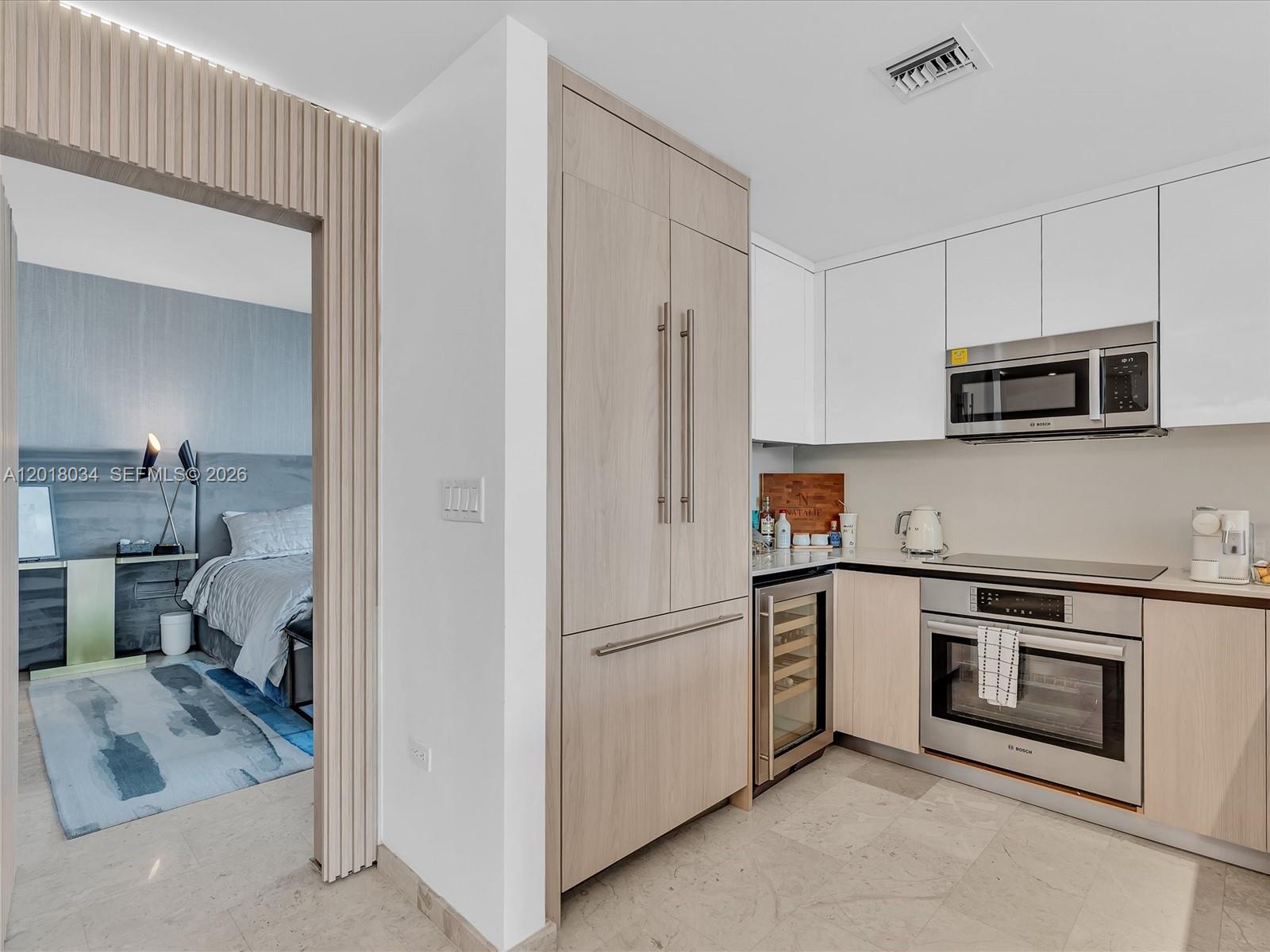 88 Southwest 7th Street, Unit 2011 Miami, FL 33130 - Photo 12 of 55 a kitchen with stainless steel appliances granite countertop a refrigerator and a sink