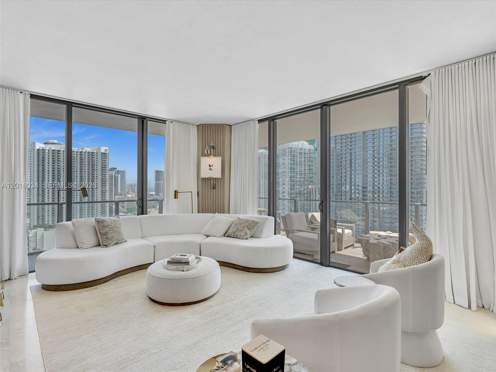 88 Southwest 7th Street, Unit 2011 Miami, FL 33130 - Photo 16 of 55 a living room with furniture and a large window