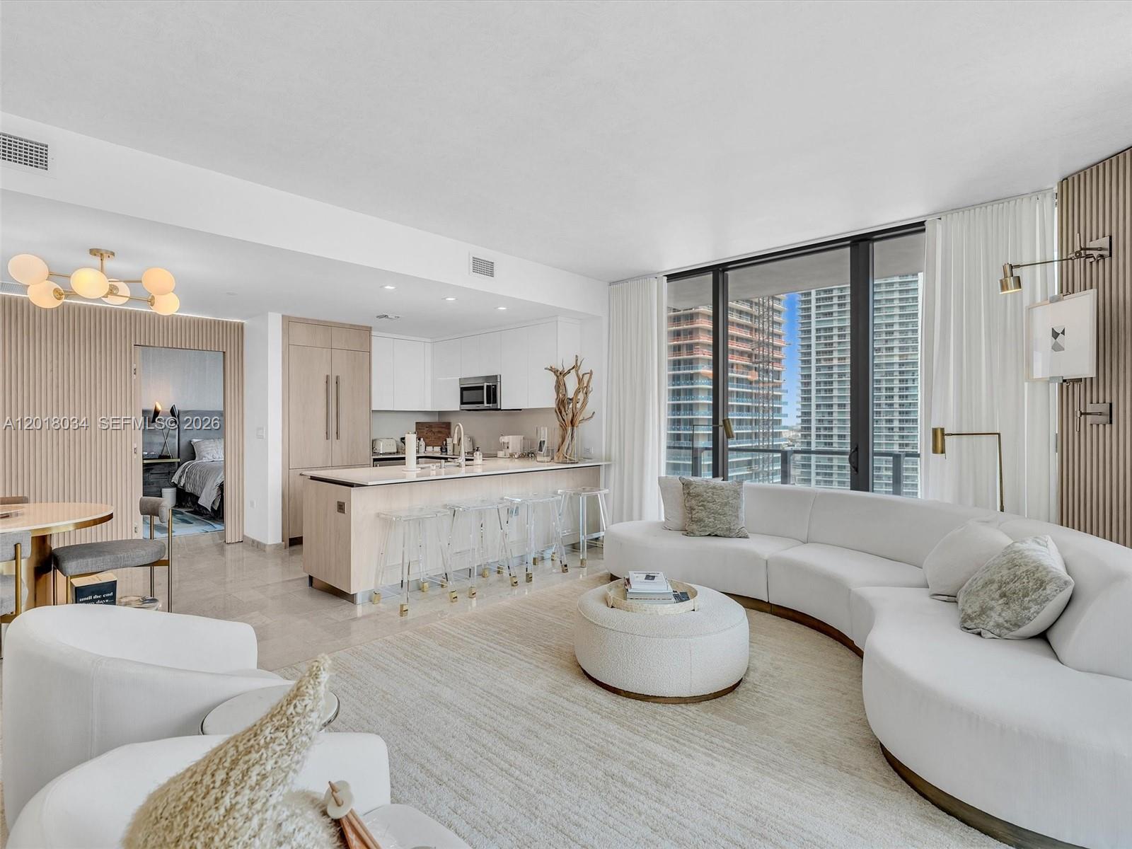 88 Southwest 7th Street, Unit 2011 Miami, FL 33130 - Photo 17 of 55 a living room with furniture and a large window