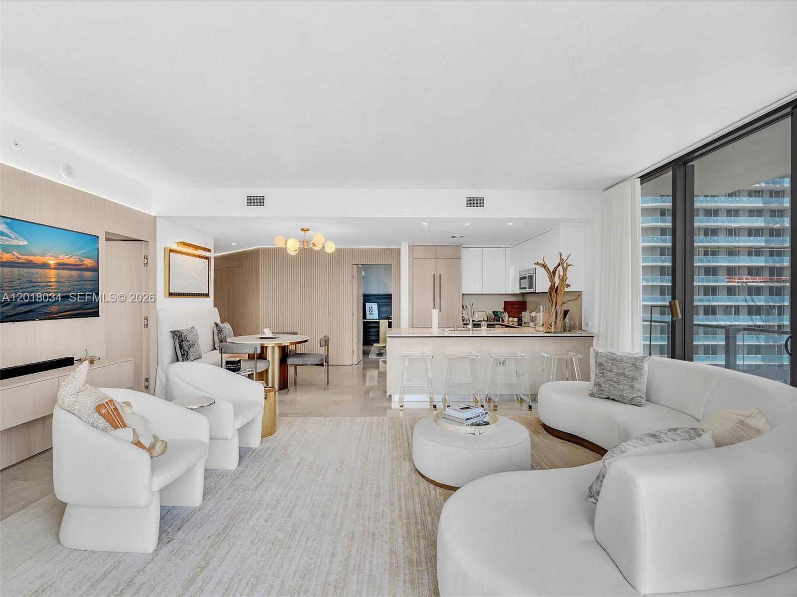 88 Southwest 7th Street, Unit 2011 Miami, FL 33130 - Photo 20 of 55 a living room with furniture and a flat screen tv
