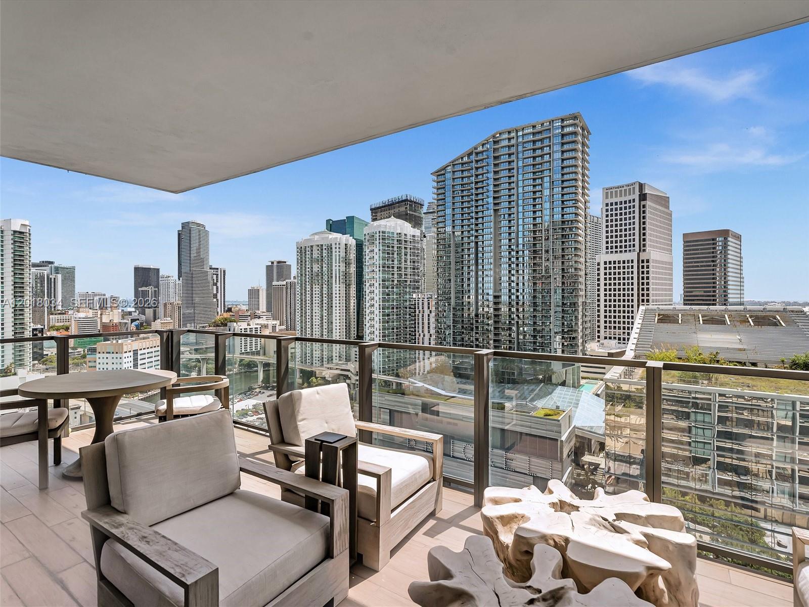 88 Southwest 7th Street, Unit 2011 Miami, FL 33130 - Photo 22 of 55 a roof deck with outdoor seating and city view
