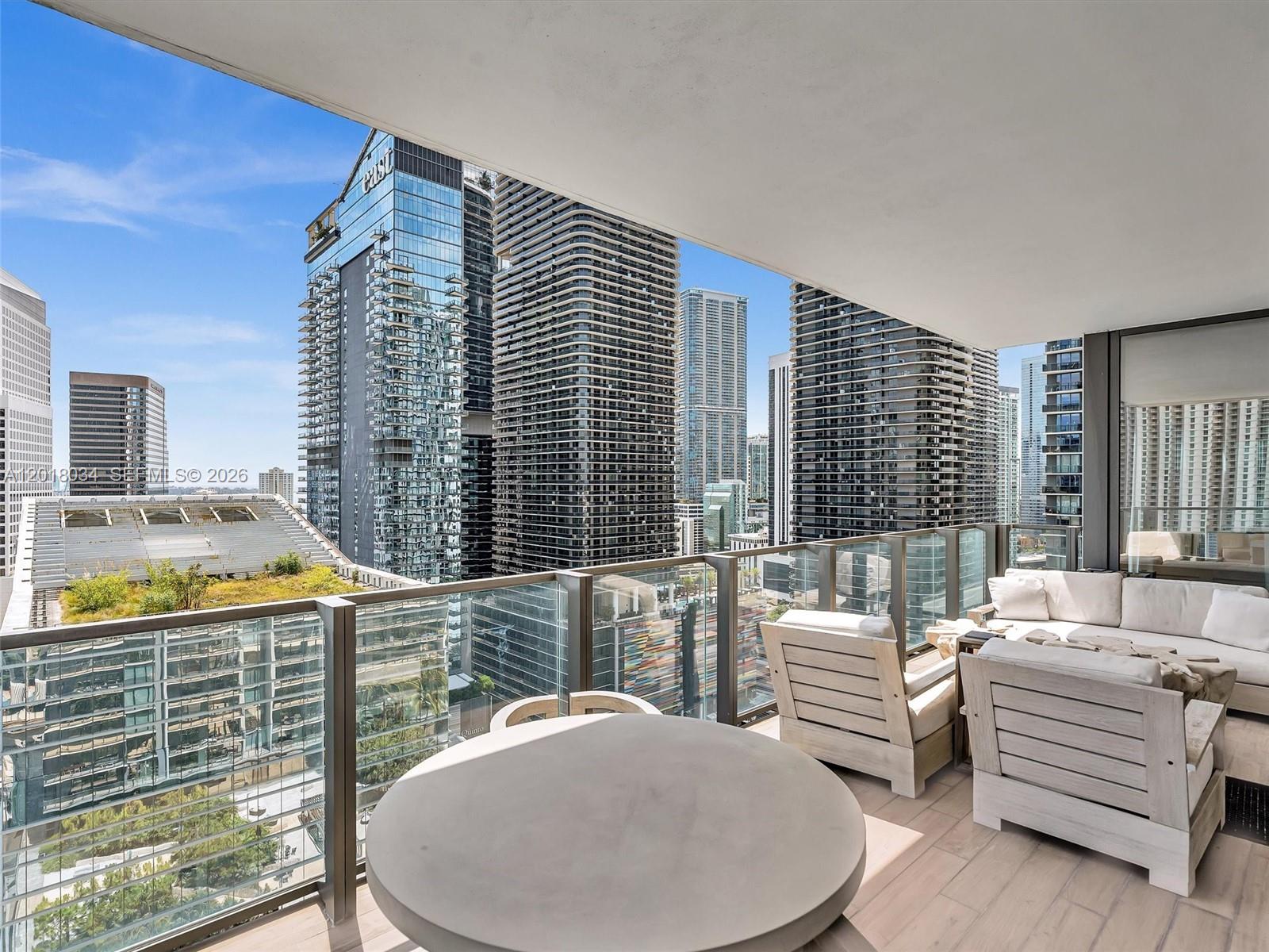88 Southwest 7th Street, Unit 2011 Miami, FL 33130 - Photo 26 of 55 a balcony with furniture and a potted plant