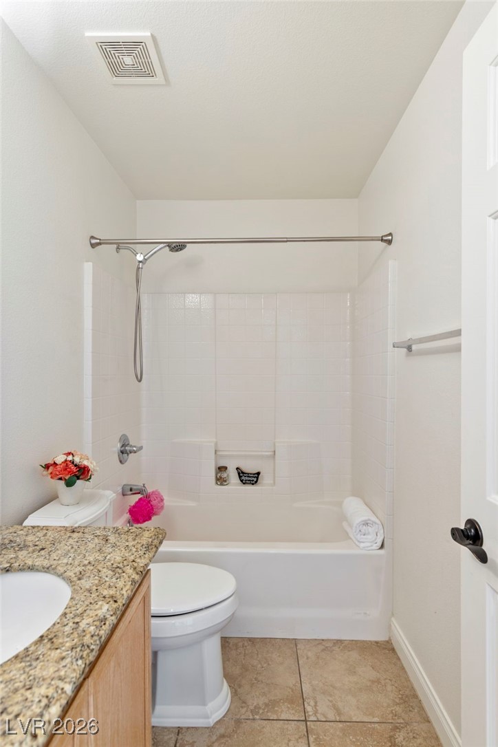 1131 Cathedral Ridge Street Henderson, NV 89052 - Photo 13 of 32 Tall toilet with easy-to-clean surround bathtub/shower and built-in shelves for shower essentials