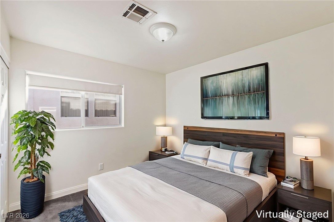 1131 Cathedral Ridge Street Henderson, NV 89052 - Photo 16 of 32 Bedroom with carpet and blinds for added warmth and comfort