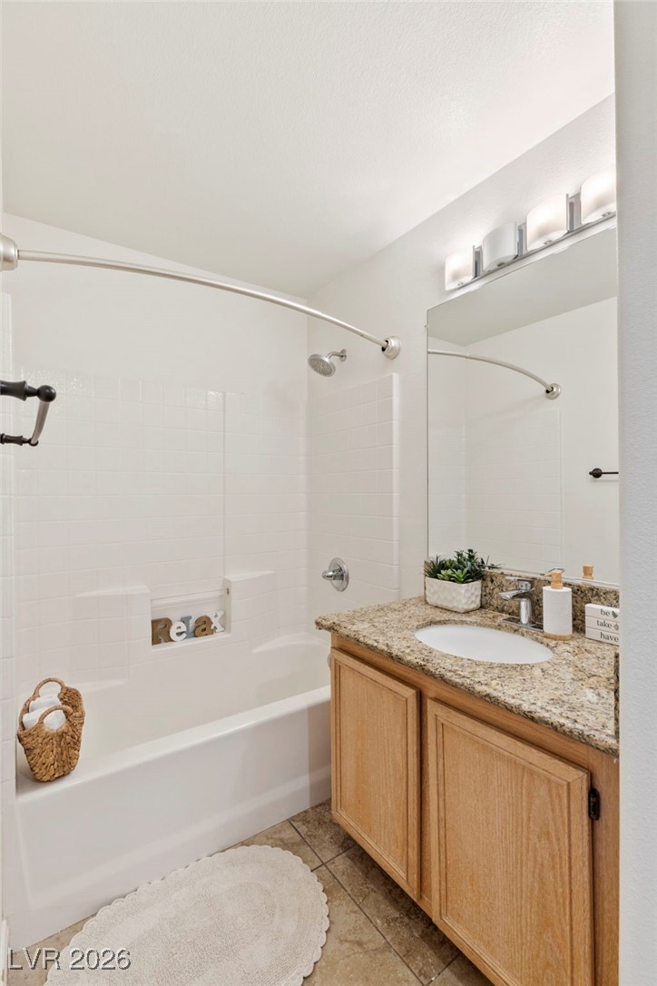 1131 Cathedral Ridge Street Henderson, NV 89052 - Photo 22 of 32 Upgraded bathroom featuring a drop-in sink, easy-to-clean surround bathtub/shower with built-in shelves, and a linen closet***Optional space for a remodel or double vanity by removing the closet***with a private toilet on the opposite side