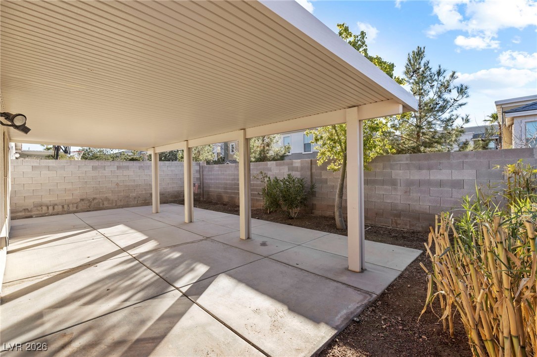 1131 Cathedral Ridge Street Henderson, NV 89052 - Photo 25 of 32 Fully covered patio with surrounding space for planting and endless possibilities to use your imagination to create a beautiful, peaceful green retreat
