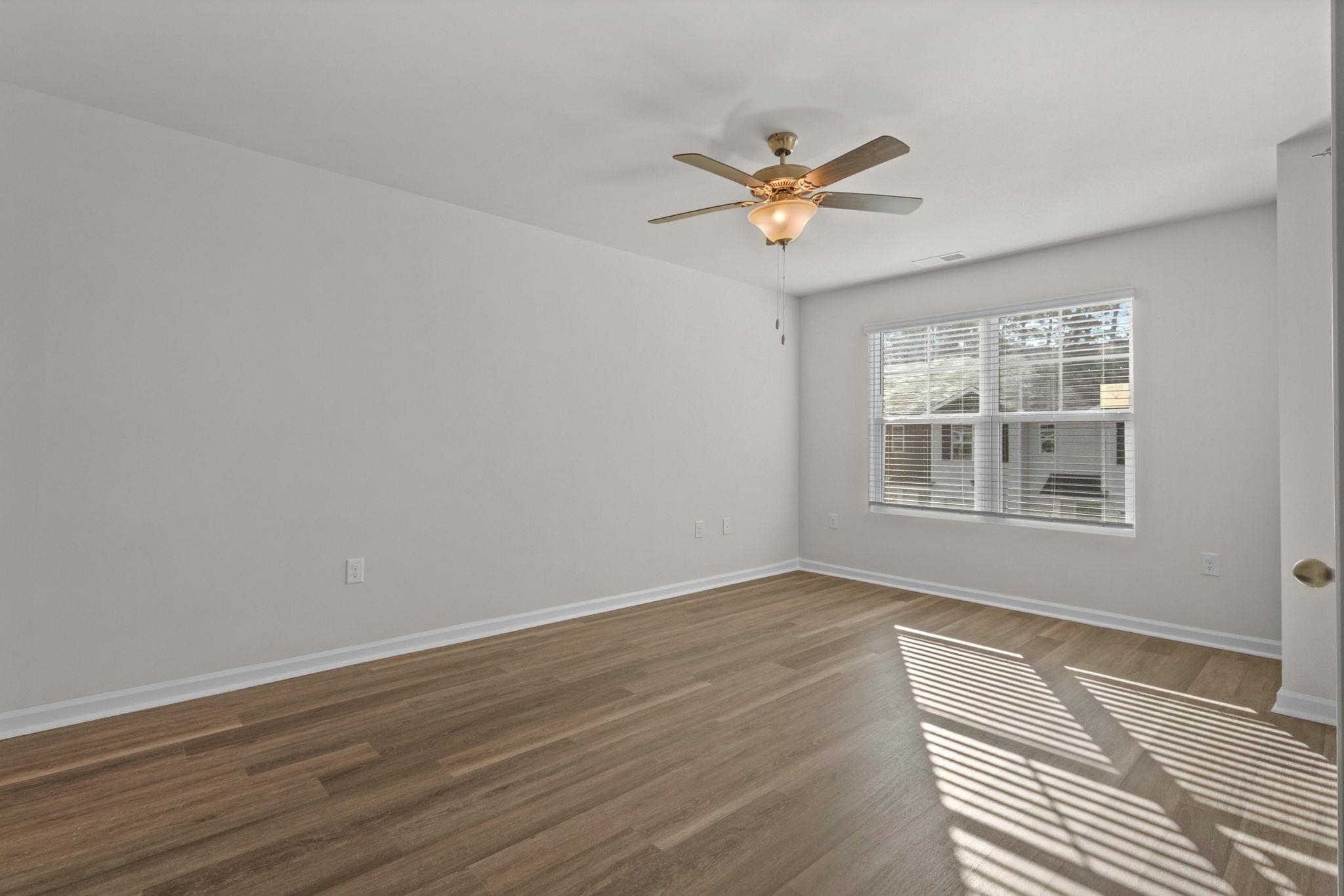 640 Golden Resin Road Conway, SC 29526 - Photo 17 of 38 Spare room featuring dark wood-style flooring and a ceiling fan
