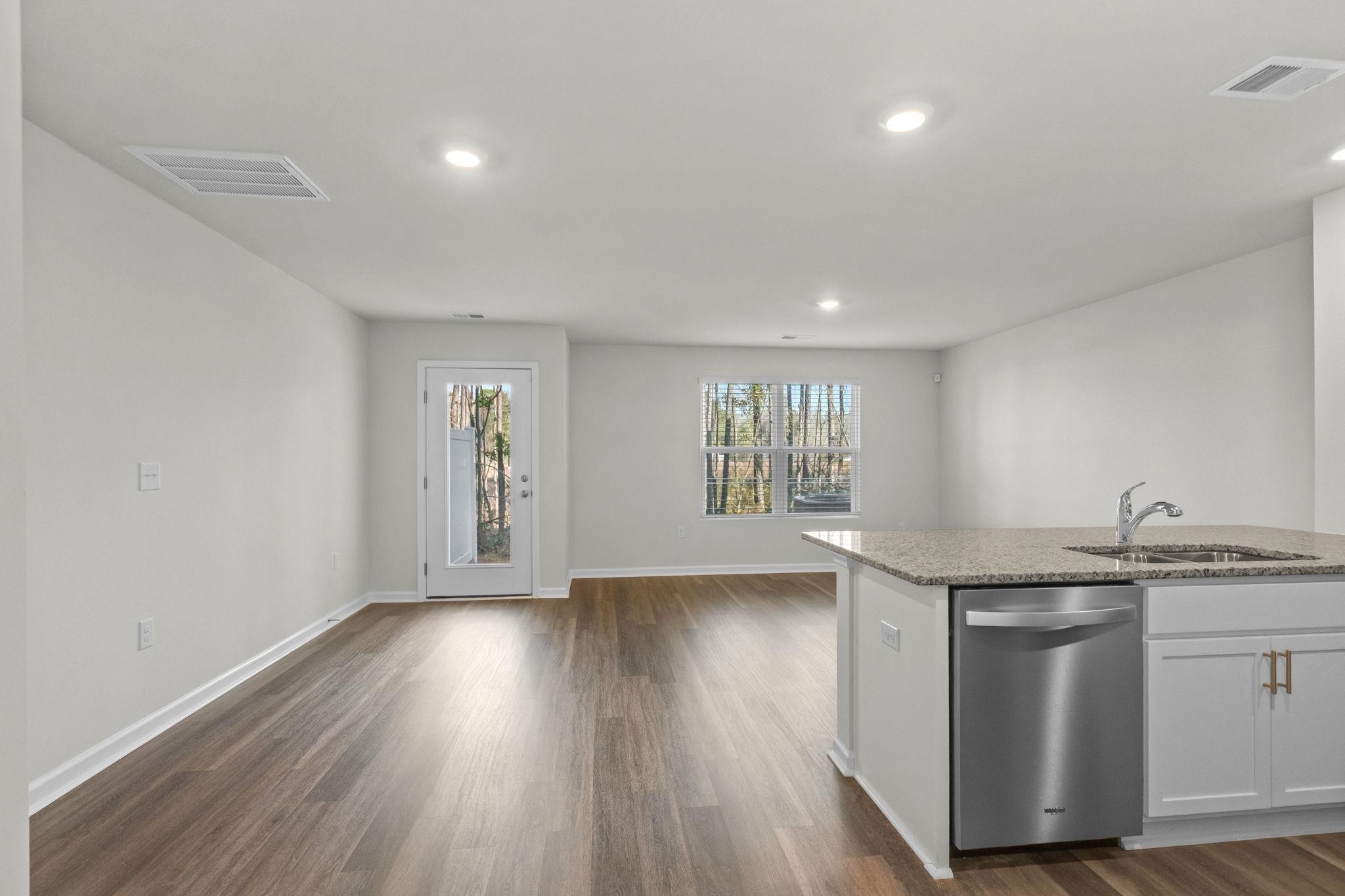 640 Golden Resin Road Conway, SC 29526 - Photo 2 of 38 Kitchen featuring stainless steel dishwasher, white cabinetry, light stone countertops, dark wood-type flooring, and recessed lighting
