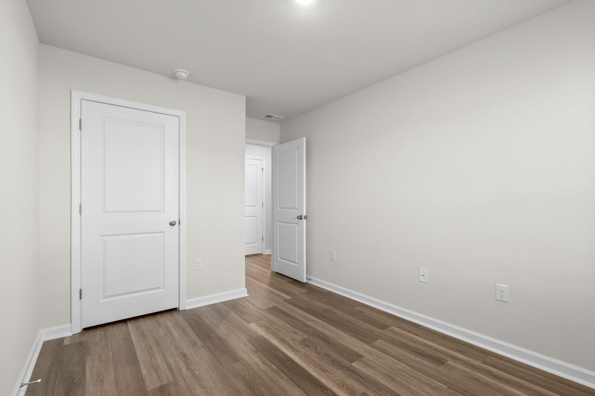 640 Golden Resin Road Conway, SC 29526 - Photo 26 of 38 Unfurnished bedroom featuring wood finished floors and baseboards