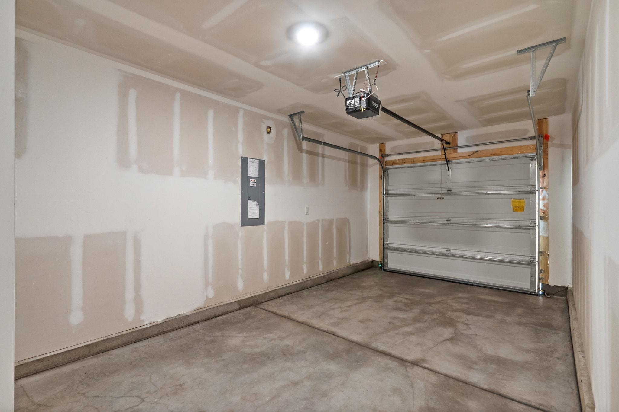 640 Golden Resin Road Conway, SC 29526 - Photo 30 of 38 Garage with electric panel and a garage door opener