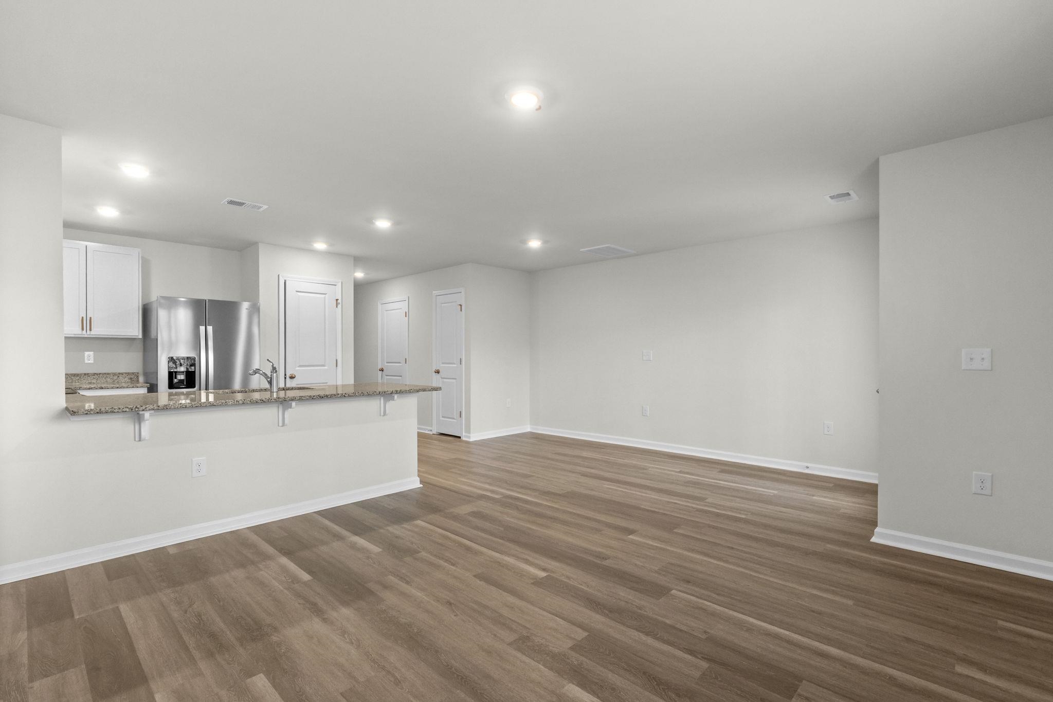 640 Golden Resin Road Conway, SC 29526 - Photo 6 of 38 Unfurnished living room featuring dark wood finished floors and recessed lighting