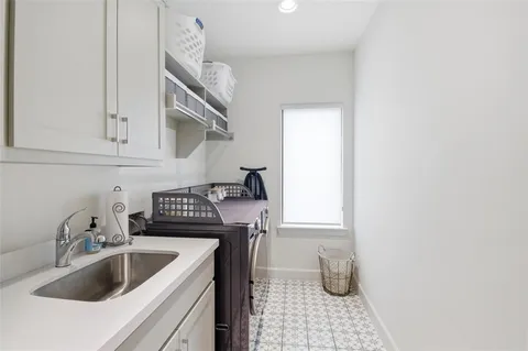 a kitchen with a sink and cabinets