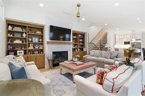 a living room with furniture fireplace and a flat screen tv