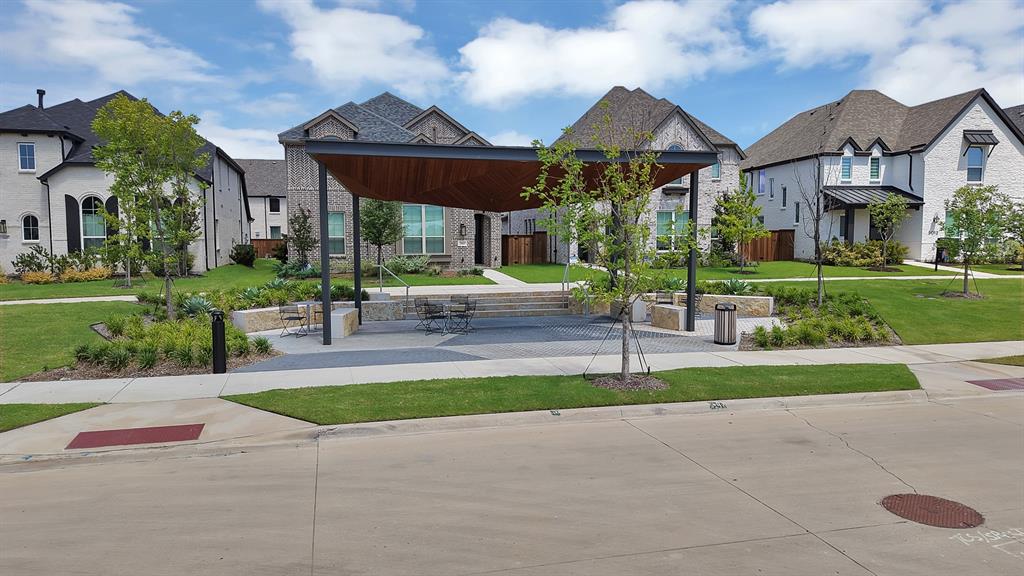 5012 Triadic Lane Prosper, TX 75078 - Photo 36 of 38 Community gathering space featuring a modern pergola, paved seating area, and integrated planters