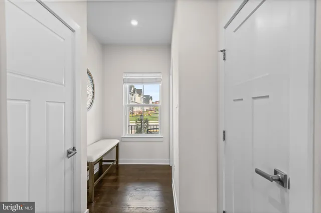 a bathroom with a sink toilet and a mirror