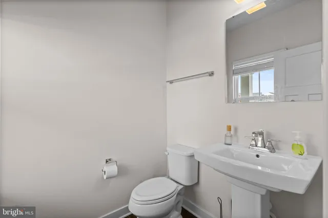 a view of entryway with wooden floor and stairs