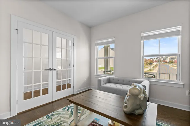 a living room with furniture and windows