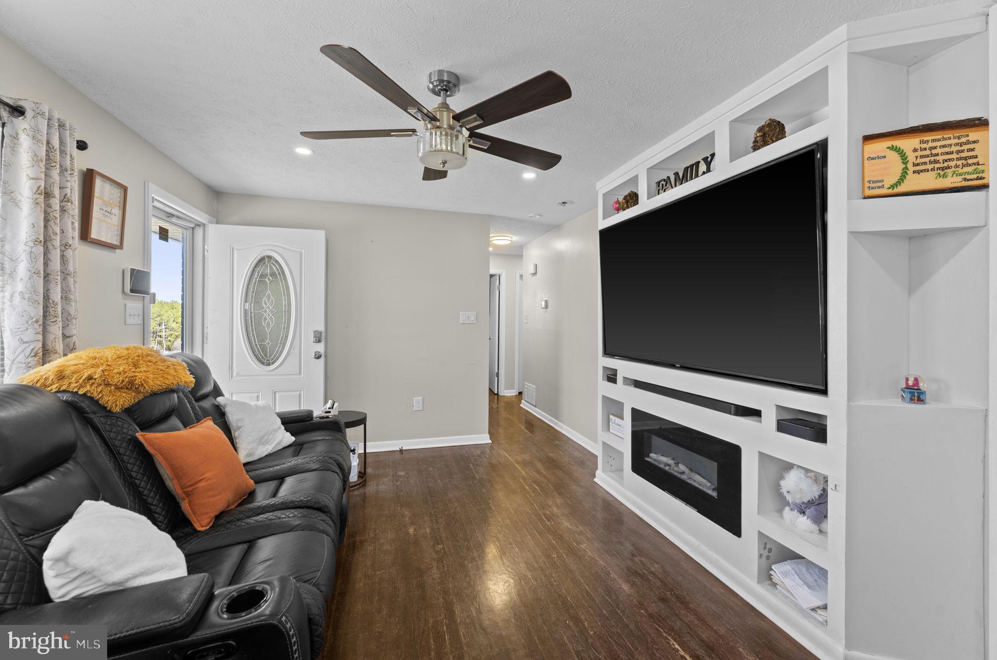 110 Bucks Mill Road Strasburg, VA 22657 - Photo 21 of 53 a living room with furniture and a flat screen tv