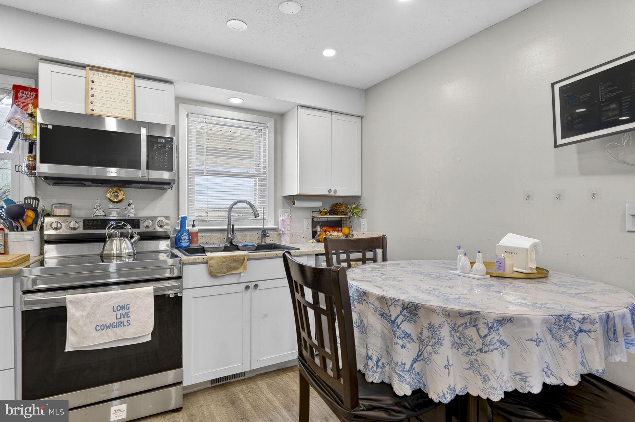 110 Bucks Mill Road Strasburg, VA 22657 - Photo 23 of 53 a kitchen with a sink stove and microwave