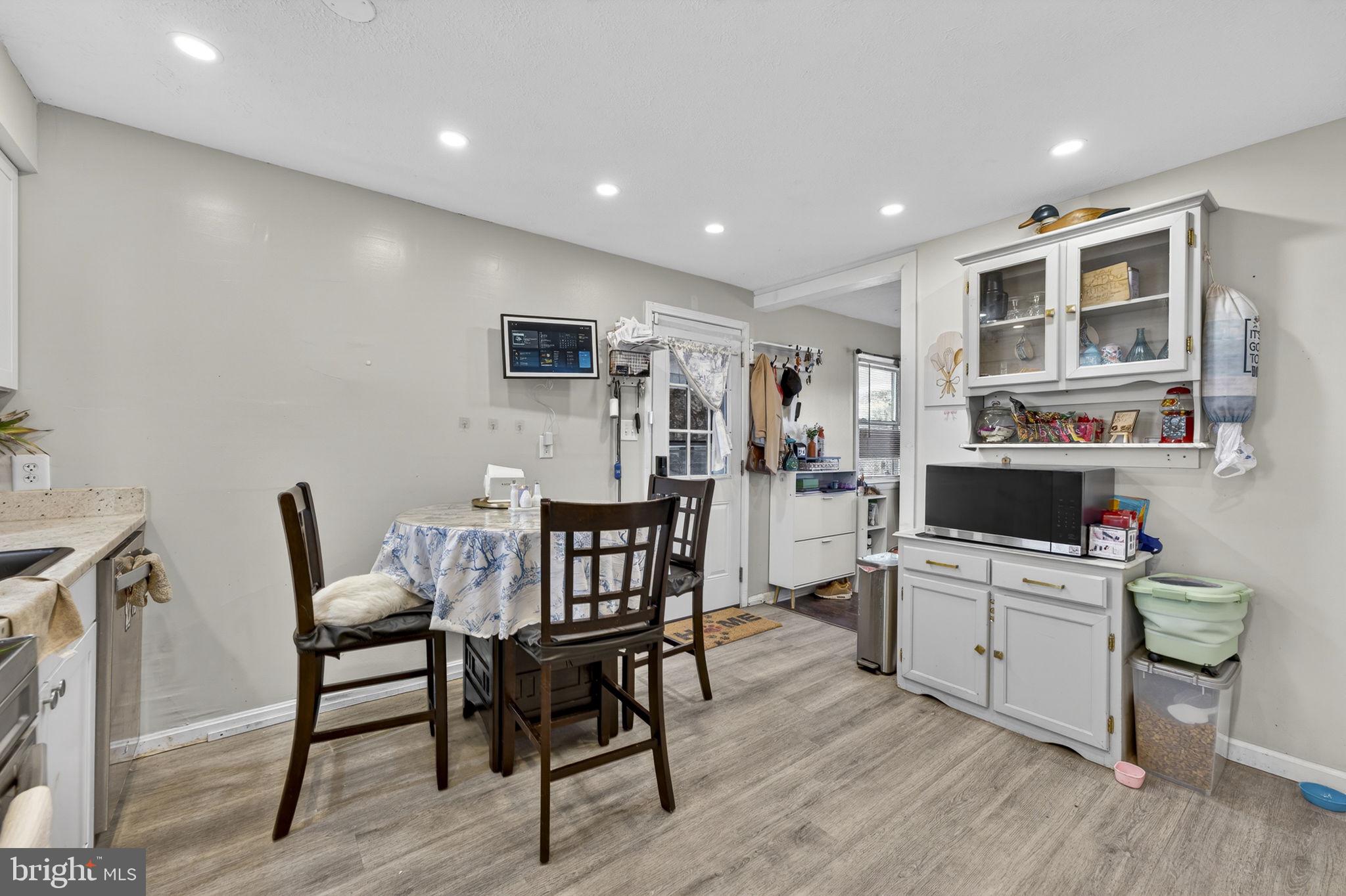 110 Bucks Mill Road Strasburg, VA 22657 - Photo 25 of 53 a living room with furniture a dining table and wooden floor