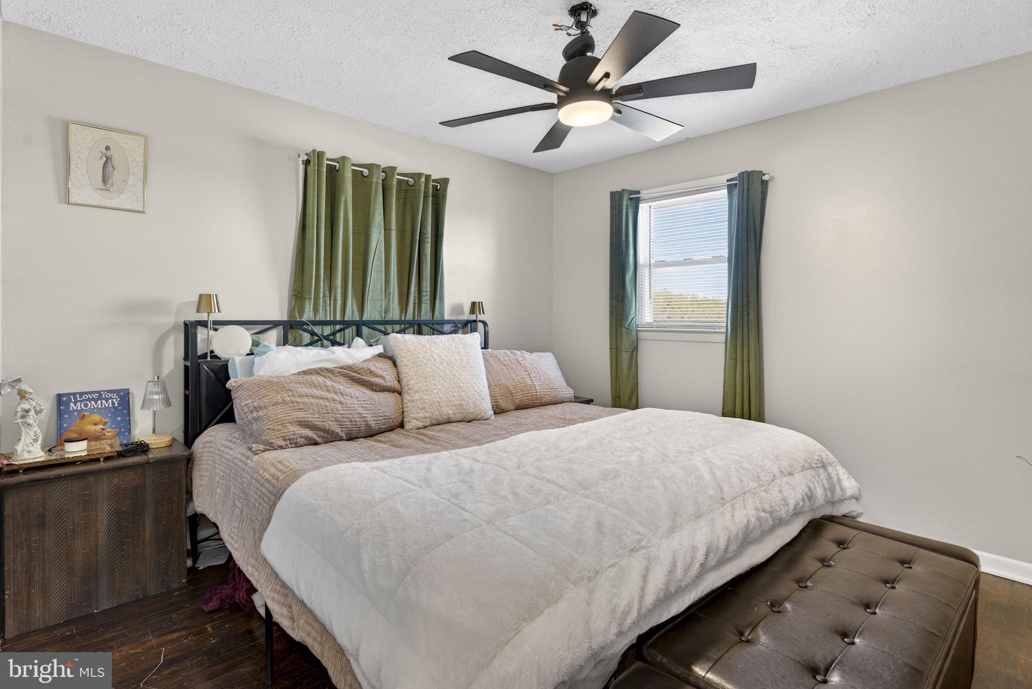 110 Bucks Mill Road Strasburg, VA 22657 - Photo 34 of 53 a bedroom with a bed and a chandelier