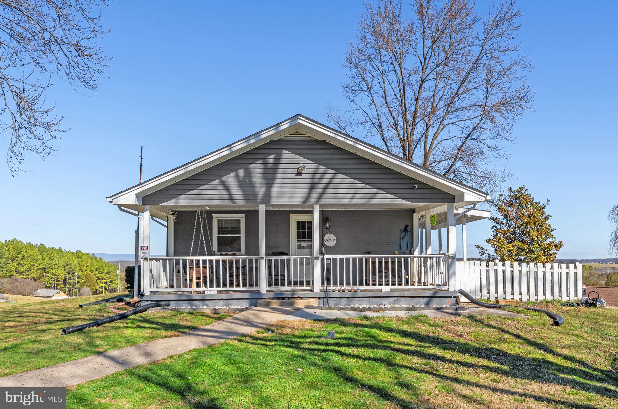 110 Bucks Mill Road Strasburg, VA 22657 - Photo 45 of 53 a front view of a house with a garden