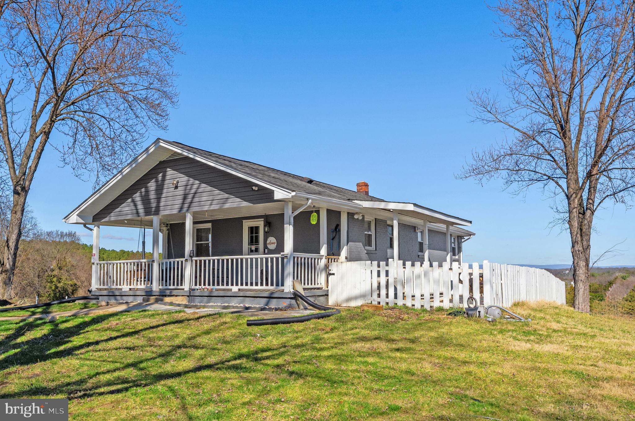 110 Bucks Mill Road Strasburg, VA 22657 - Photo 46 of 53 a front view of a house with a yard table and chairs