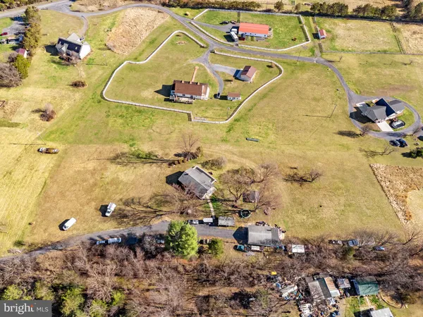 a view of a yard with wooden fence