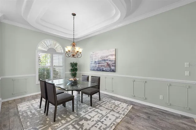 a living room with furniture and next to a window