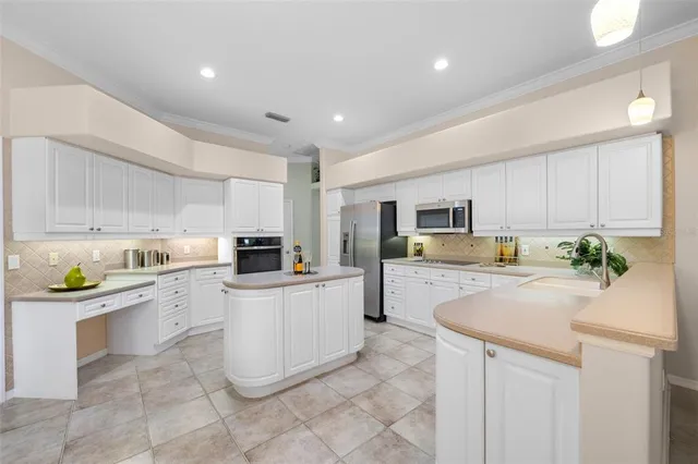 a kitchen with a sink a stove and refrigerator