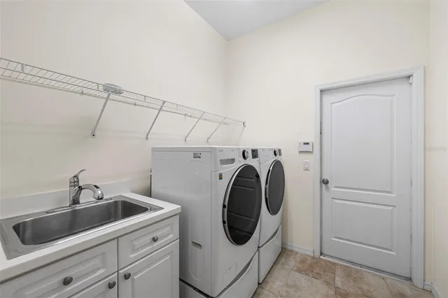 a view of a livingroom with a dinning area hardwood floor ceiling fan and window