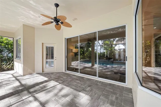 an aerial view of residential houses with outdoor space and trees
