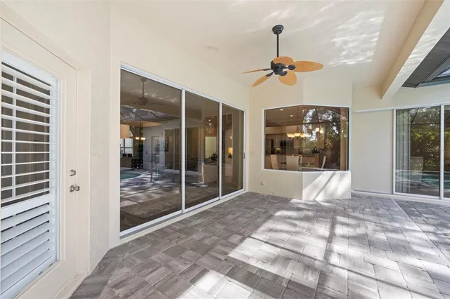 an aerial view of residential houses with outdoor space and trees