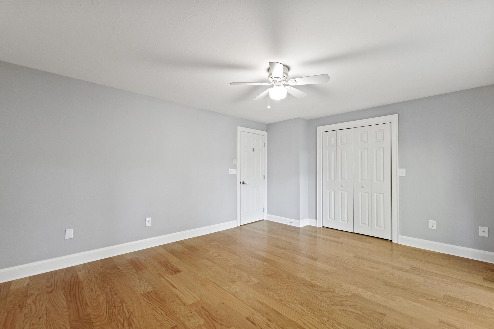 24 Ryan's Way, Unit 6 Mashpee, MA 02649 - Photo 12 of 23 a view of an empty room and chandelier fan