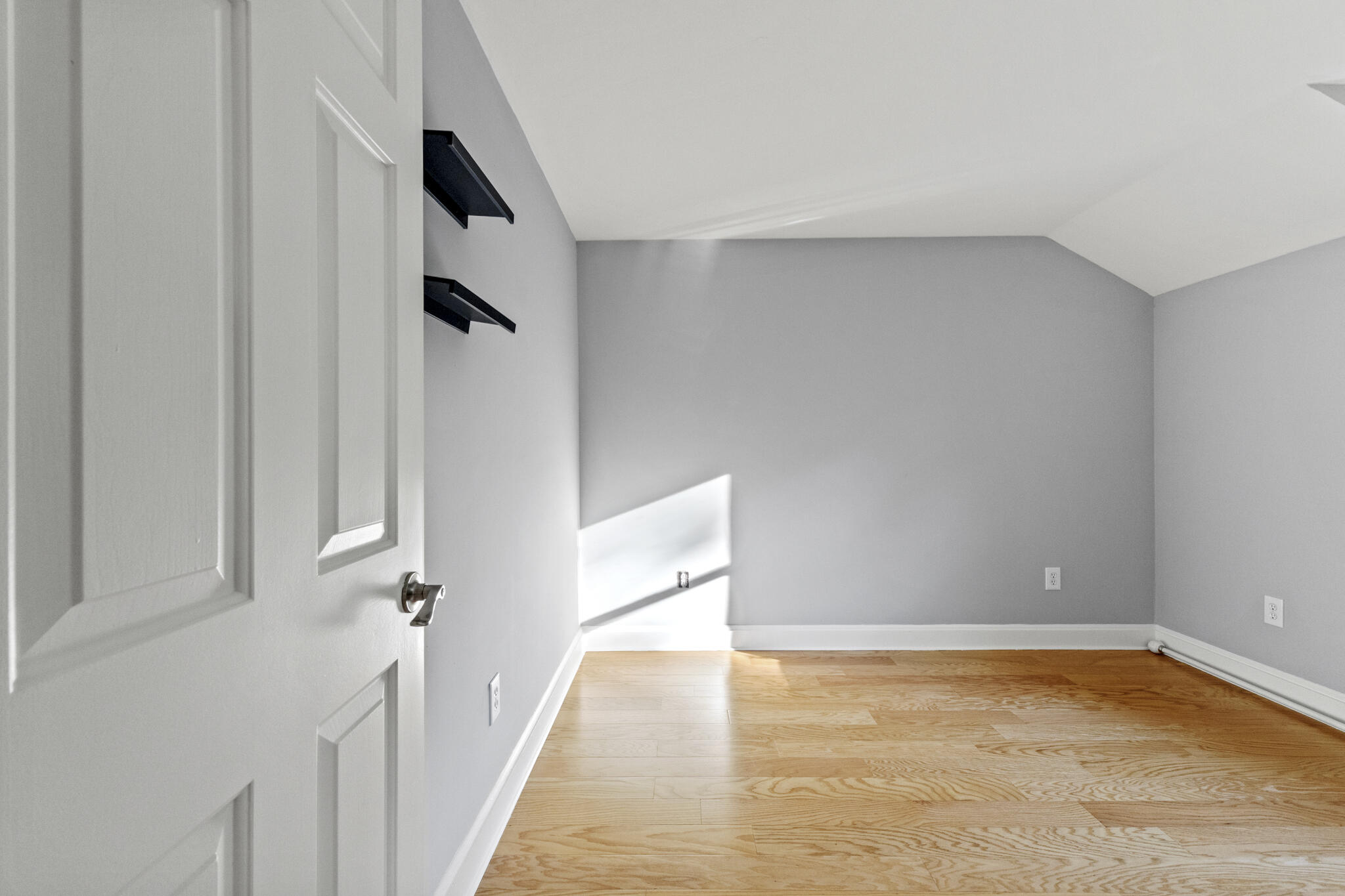 24 Ryan's Way, Unit 6 Mashpee, MA 02649 - Photo 14 of 23 a view of an empty room with wooden floor