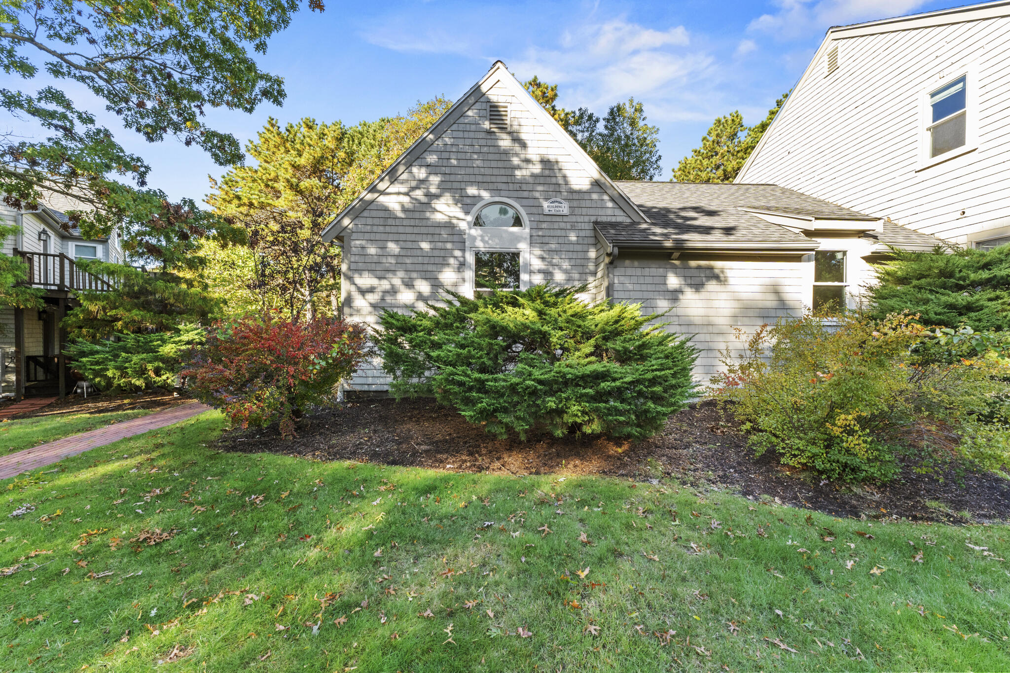 24 Ryan's Way, Unit 6 Mashpee, MA 02649 - Photo 22 of 23 a aerial view of a house with a yard