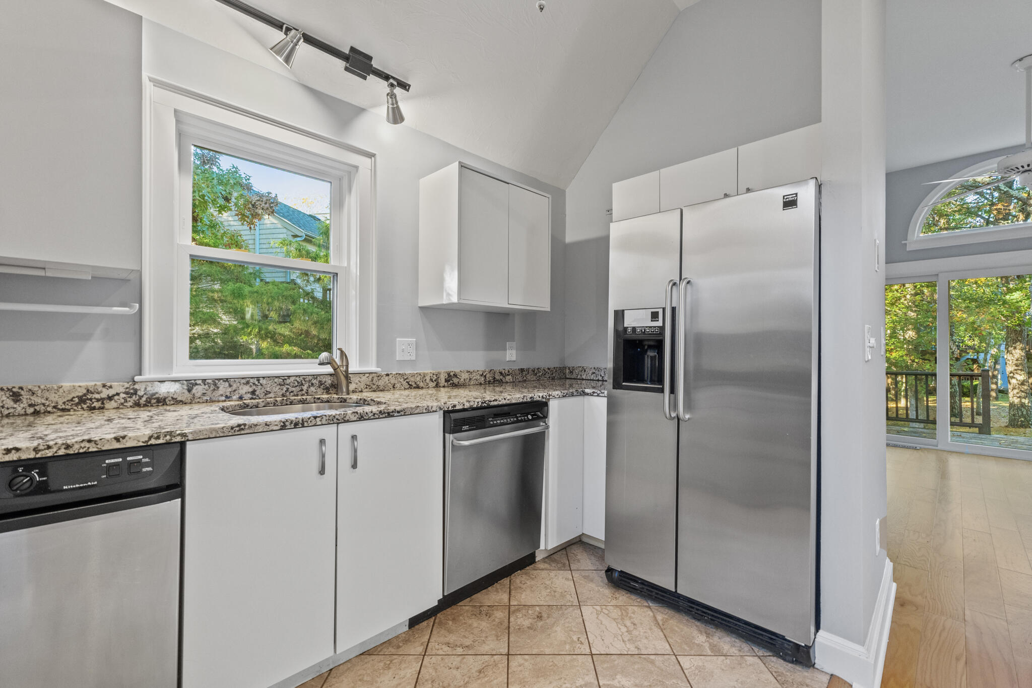 24 Ryan's Way, Unit 6 Mashpee, MA 02649 - Photo 10 of 23 a kitchen with stainless steel appliances granite countertop a refrigerator and a sink