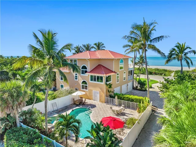a view of swimming pool with a table and chairs