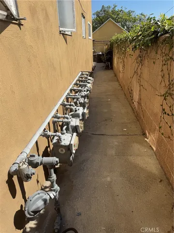 a bed sitting in a bedroom next to a larger window