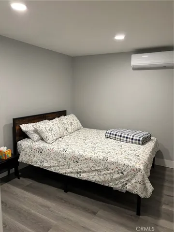a kitchen with a refrigerator and a stove top oven