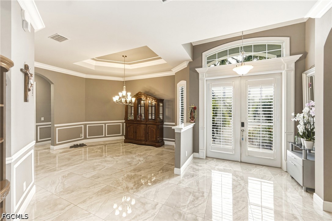 1700 43rd Terrace Southwest Naples, FL 34116 - Photo 27 of 38 a view of a livingroom with wooden floor and a window