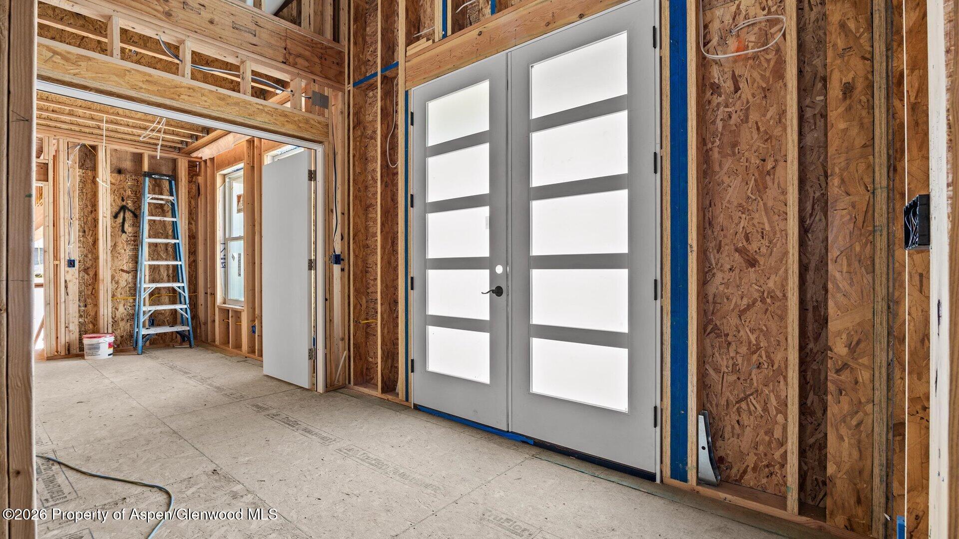1384 Munro Avenue Rifle, CO 81650 - Photo 8 of 38 a view of a room with large windows