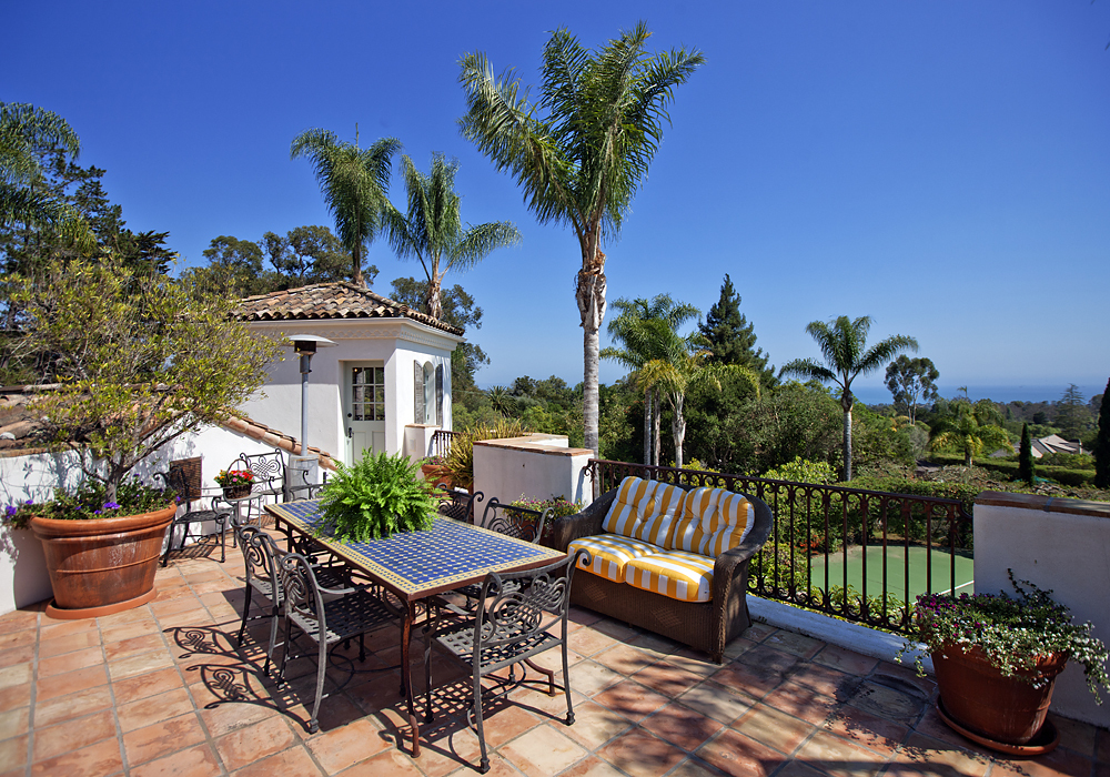 669 Hot Springs Road Montecito, CA 93108 - Photo 1 of 26 a view of a chairs and table in the back yard of the house