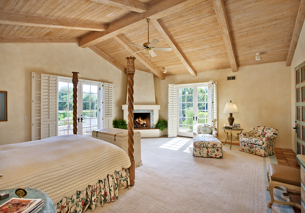 669 Hot Springs Road Montecito, CA 93108 - Photo 14 of 26 a spacious bedroom with a bed couch and a window
