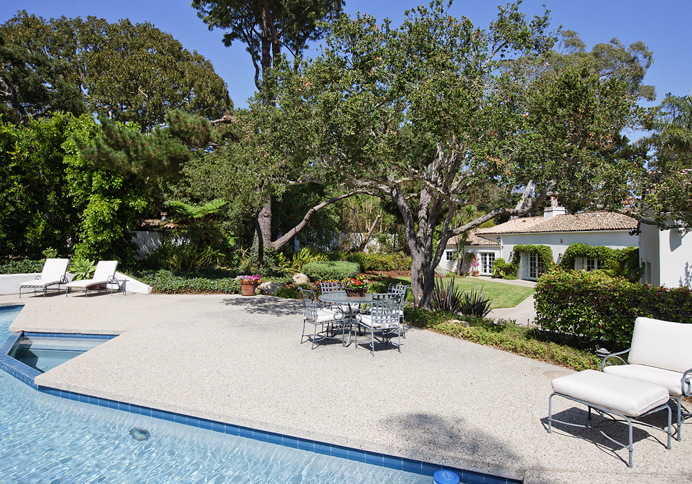 669 Hot Springs Road Montecito, CA 93108 - Photo 4 of 26 a view of a patio with table and chairs under an umbrella