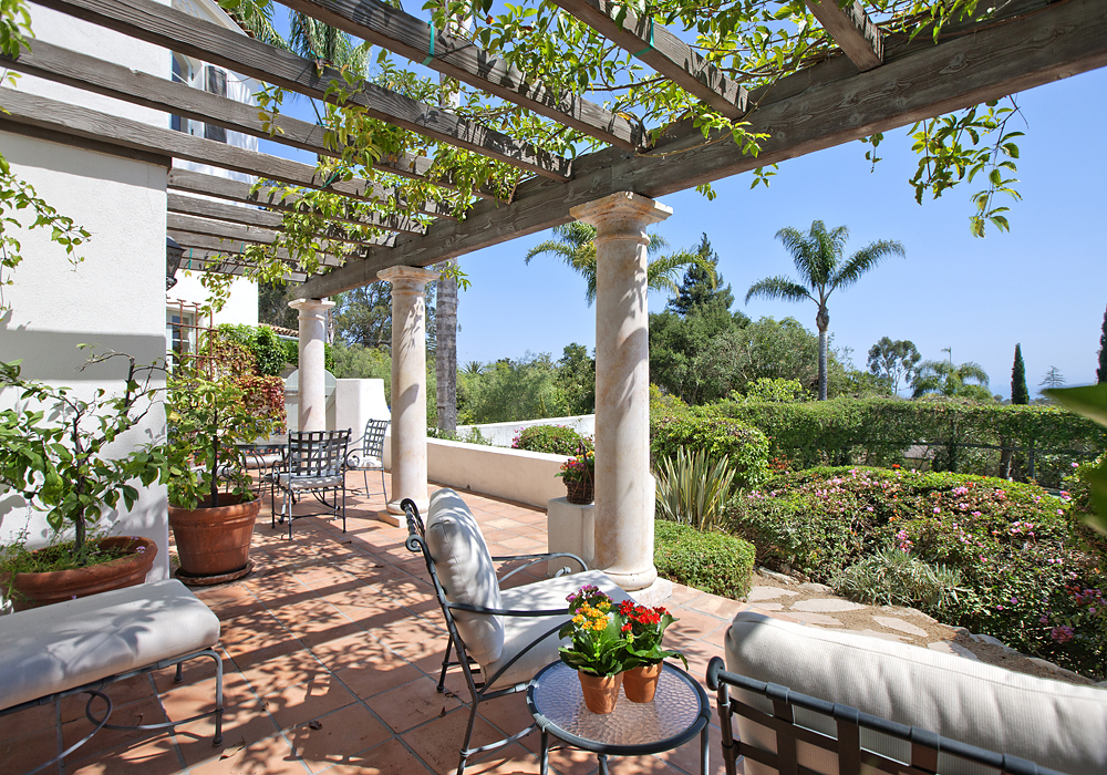 669 Hot Springs Road Montecito, CA 93108 - Photo 5 of 26 a view of a chairs and table in a patio
