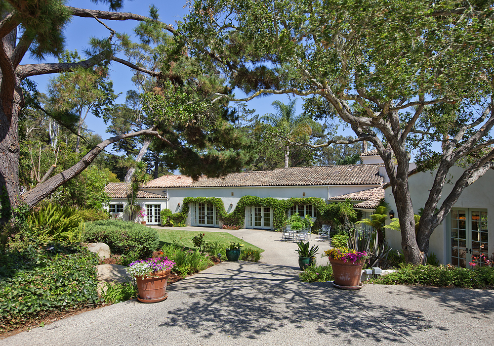 669 Hot Springs Road Montecito, CA 93108 - Photo 7 of 26 a view of a patio with table and chairs potted plants and large tree