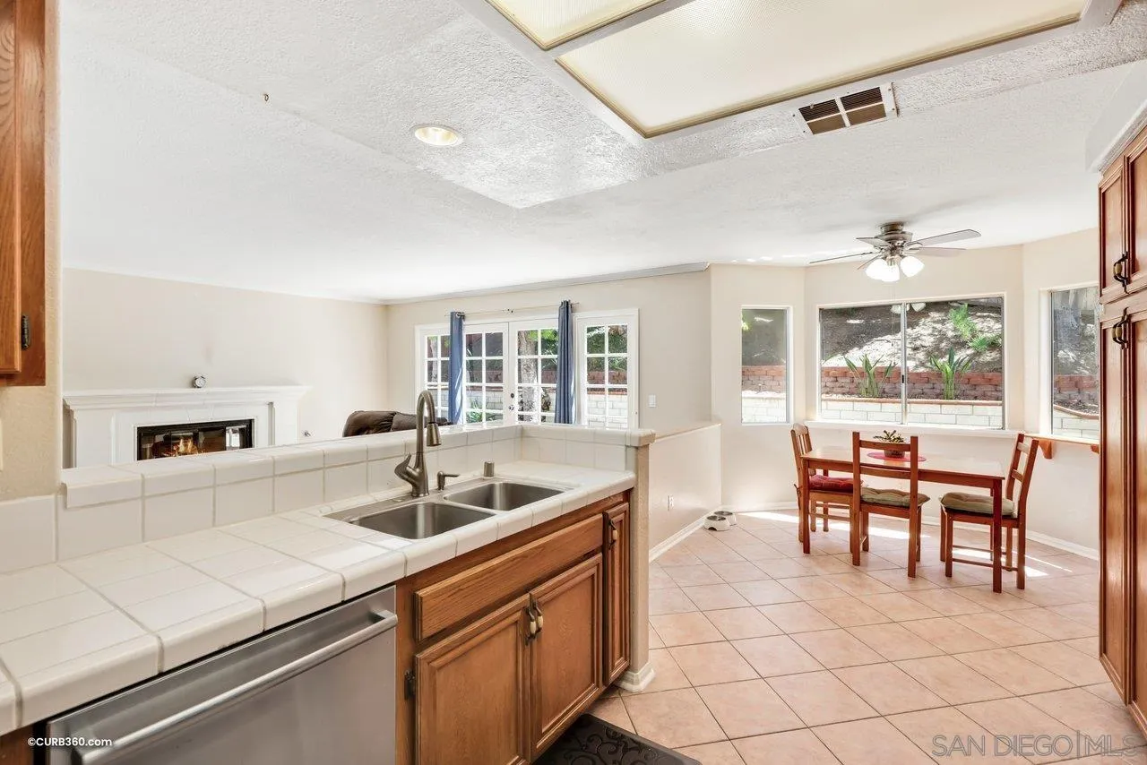 5138 Vía Madrid Oceanside, CA 92057 - Photo 13 of 32 a kitchen with counter top space and dining table